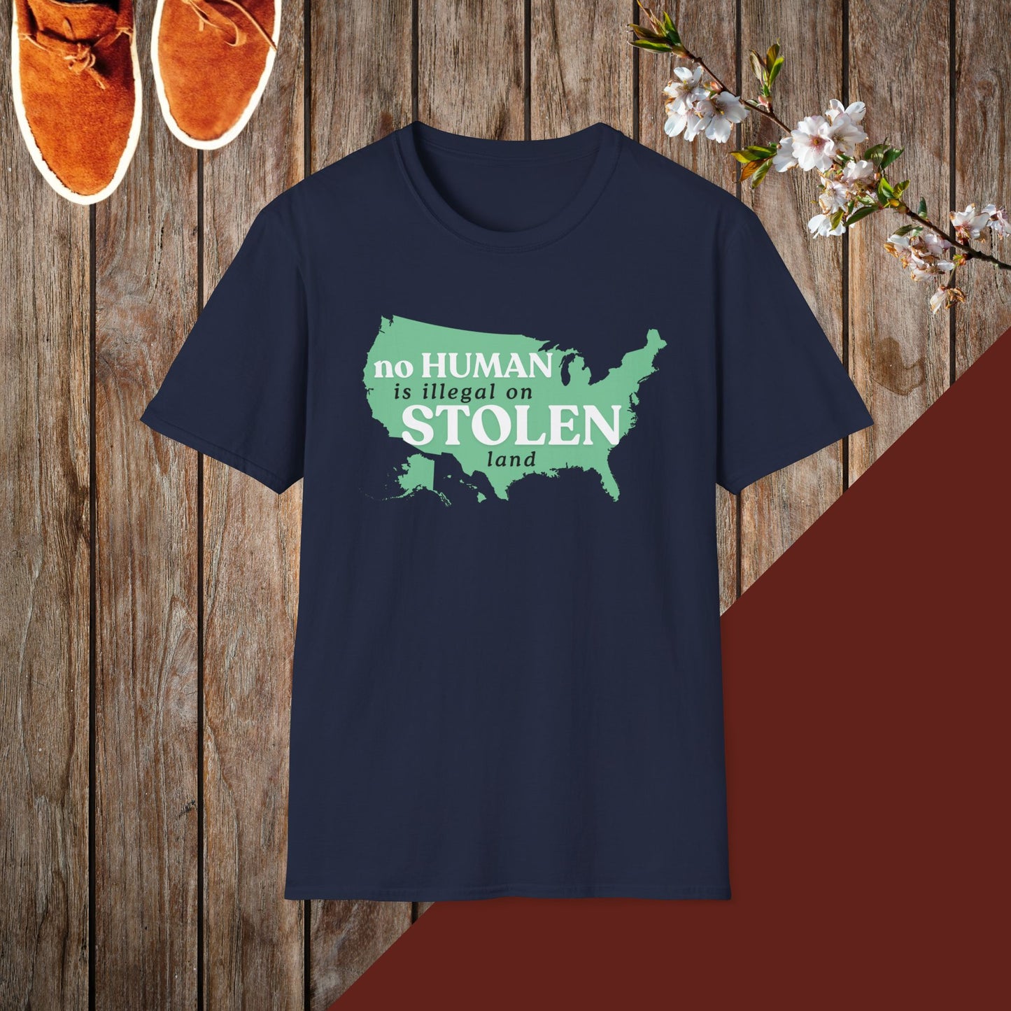 No Human is Illegal on Stolen Land Unisex Softstyle T-Shirt with 'No Human is Illegal on Stolen Land' Print
