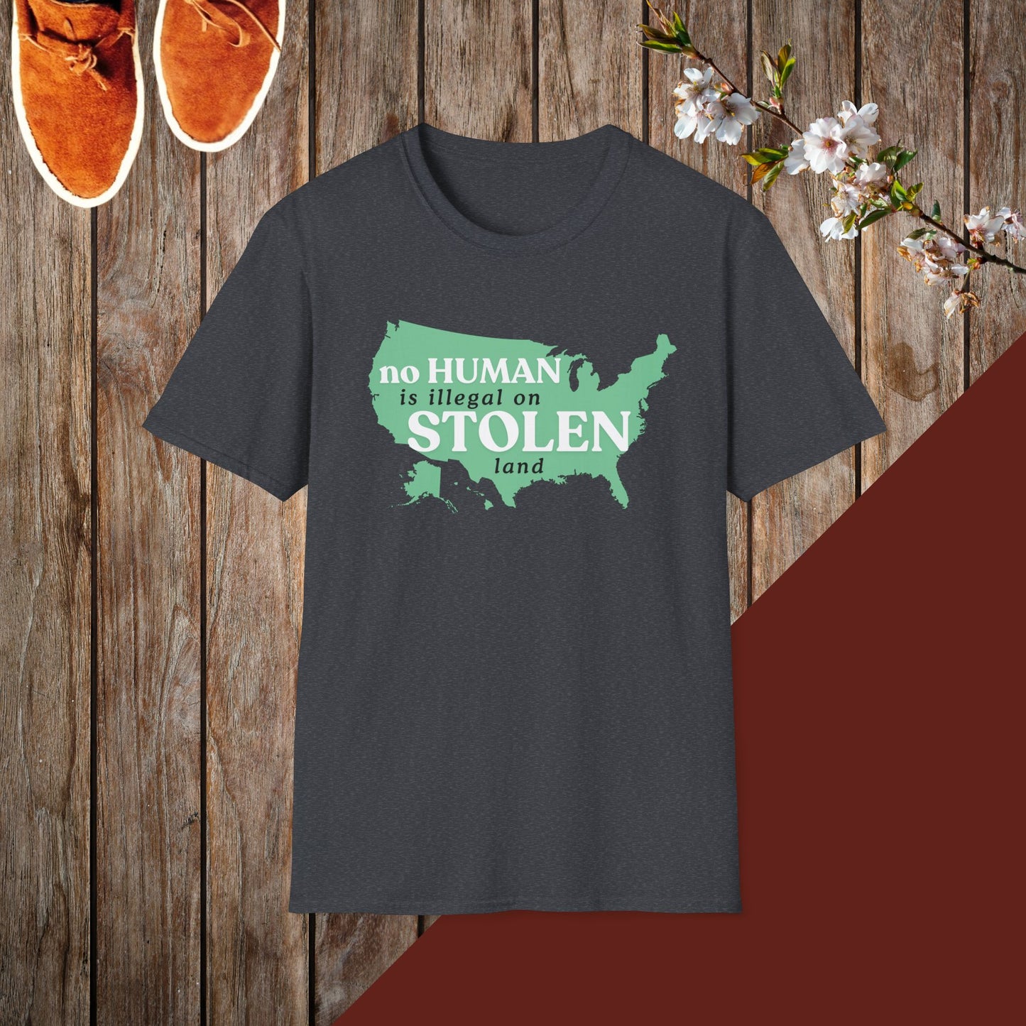 No Human is Illegal on Stolen Land Unisex Softstyle T-Shirt with 'No Human is Illegal on Stolen Land' Print